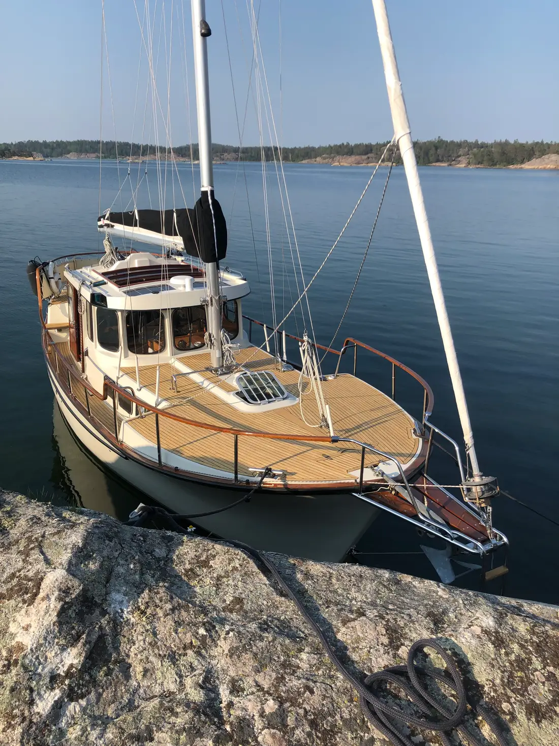 Sailboat moored by a rock in the archipelago